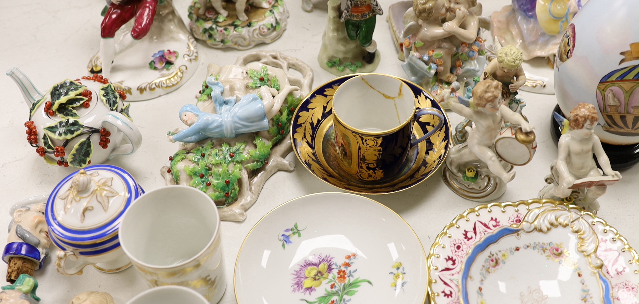 A large group of mainly continental table wares and figurines
